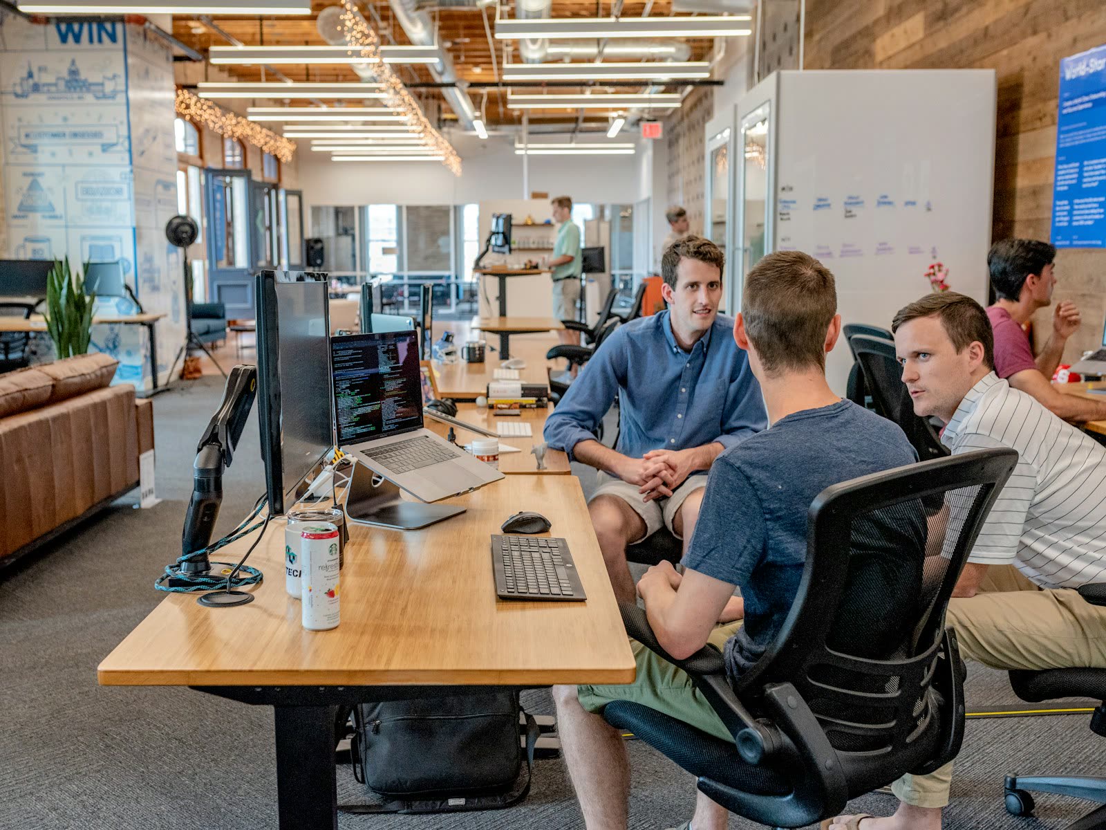 Senior executives in a refined office discussing a strategic business decision